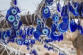Folk Turkish talismans from the evil eye are hung over the trees in the Cappadocia, Turkey,
