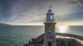 The Folkestone Harbour Arm Lighthouse shortly after sunrise