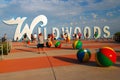 Folks pose at the Wildwoods sign