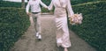 Follow the beautiful bride. Wedding couple walking together.