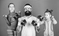 Follow father. Girls cute kids exercising with dumbbells with dad. Motivation and sport example concept. Children repeat