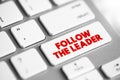 Follow The Leader text button on keyboard, concept background Royalty Free Stock Photo