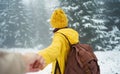 first person view of girl going to snowy mysterious forest, couple at winter vacation