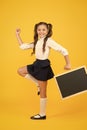 Follow me. Schoolgirl pupil informing. School girl hold blank chalkboard copy space. Announcement and promotion. Girl