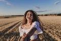 Follow me. Young woman holding hand and leading man to the beautiful nature sunset yellow landscape. View from back side, POV. Royalty Free Stock Photo