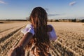 Follow me. Young woman holding hand and leading man to the beautiful nature sunset yellow landscape. View from back side, POV. Royalty Free Stock Photo