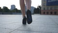 Follow to female legs in high heels shoes walking in the urban street. Feet of young business woman in high-heeled Royalty Free Stock Photo