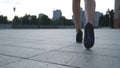 Follow to female legs in high heels shoes walking in the urban street. Feet of young business woman in high-heeled Royalty Free Stock Photo