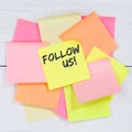 Follow us follower followers fans likes social networking media internet desk note paper Royalty Free Stock Photo