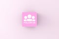 Follow us message on a pink cube block. Social Media Networking Internet Online Concept