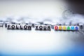 Follow your dreams text made from plastic letter beads Royalty Free Stock Photo