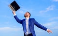 Follow your interests. Businessman formal suit follow laptop. He has a dream. Man inspired holds laptop above himself