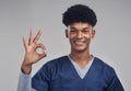 Follow your passion and purpose and stay true to yourself. a male nurse showing the ok sign while standing against a Royalty Free Stock Photo
