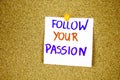 follow your passion on Sticky note with inscription pinned on a cork bulletin board Royalty Free Stock Photo