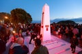 Anzac Day 2018, Mount Maunganui NZ: People lay poppies around the base of the cenotaph Royalty Free Stock Photo