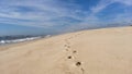 Following footprints on Beach Shore