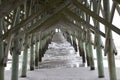 Folly Beach South Carolina, February 17, 2018 - view down beach and ocean under fishing pier