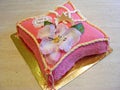 Fondant cake in form of pillow with flower for girl