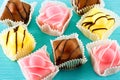 Colourful little fondant cakes. Royalty Free Stock Photo