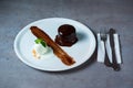 Fondant chocolate with ice ream served in dish isolated on grey background top view of bahrain food