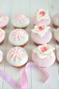 Fondant cupcakes on wooden table