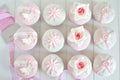 Fondant cupcakes on wooden table with ribbon