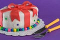 Fondant Gift Cake With Fork and Knife Royalty Free Stock Photo