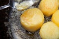 fondant potato frying in sauce pan. butter basting food with spoon whilst cooking. gourmet restaurant dish Royalty Free Stock Photo