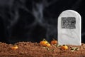 Fondant scene of halloween, grave surrounded by pumpkins, chocolate cake ground