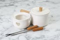 Fondue set on white marble table. Kitchen equipment Royalty Free Stock Photo