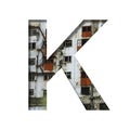 Font on an abandoned industrial building. The letter K cut out of paper on a background of windows and doors of an abandoned