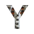 Font on an abandoned industrial building. The letter Y cut out of paper on a background of windows and doors of an abandoned