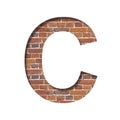 Font on brick texture. Letter C, cut out of paper on a background of real brick wall. Volumetric white fonts set