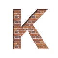 Font on brick texture. Letter K, cut out of paper on a background of real brick wall. Volumetric white fonts set