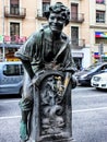 Font del Trinxa - a drinking water fountain in Barcelona by Josep Campeny. Bronze statue of a boy sitting on a fountain.