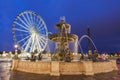 Fontaine des Fleuves and Ferris Wheel on Place de la Concorde in Royalty Free Stock Photo