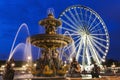 Fontaine des Fleuves and Ferris Wheel on Place de la Concorde in Royalty Free Stock Photo