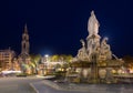 Fontaine Pradier illuminated at dusk in Nimes old town