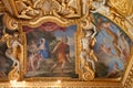 Ceiling fresco decorated with sculptures of mythical creatures in the Palace of Fontainebleau