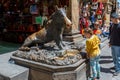 Fontana del Porcellino / Florence / Italy - July 05, 2019: People visiting the bronze statue of the wild boar in Florence, Italy