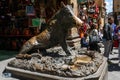 Fontana del Porcellino / Florence / Italy - July 05, 2019: People visiting the bronze statue of the wild boar in Florence, Italy