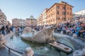 Fontana della Barcaccia Fountain of the Boat and crowded tourists on Piazza di Spagna