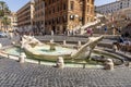 Fontana della Barcaccia in Piazza Spagna. This fountain is at the center of the square, represents a wrecked ship, made by Pietro Royalty Free Stock Photo