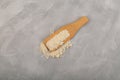 Food additive E234 in wooden scoop. Nisin powder inhibits yeast growth, effective drug against mold, natural antimicrobial