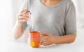 Close up of woman adding sweetener to cup of tea Royalty Free Stock Photo