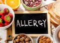 Food allergy. Allergic food on wooden background. Royalty Free Stock Photo