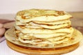 Food. Appetizing baked, thick yeast pancakes are stacked on a pl Royalty Free Stock Photo