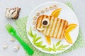 Food art idea - grilled sandwich shaped fish Royalty Free Stock Photo