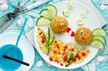 Food art idea healthy lunch for kids meatballs with bulgur porridge and fresh vegetables shaped cute fishes