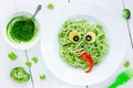 Food art idea for kids green monster from spaghetti, olives and